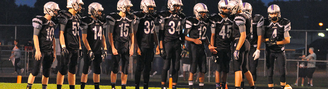 Photo of football team before a play.